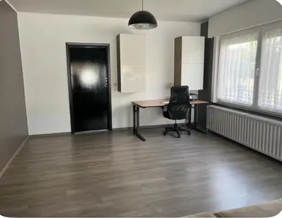 an empty office with a desk and a chair at Dar Laila in Vilvoorde