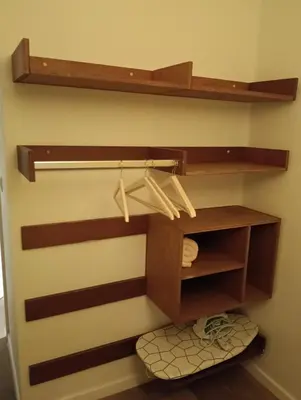a bathroom with wooden shelves and a toilet at Localização privilegiada in Brussels