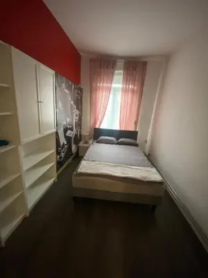 a small bedroom with a bed and a window at Sportpaleis afasdome in Antwerp