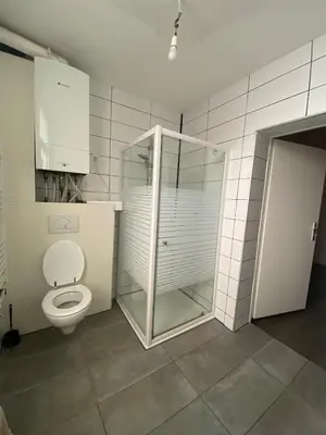 a bathroom with a toilet and a glass shower at Sportpaleis afasdome in Antwerp