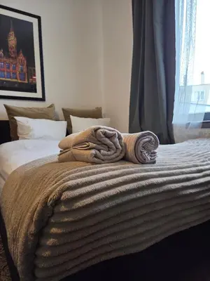 a blanket on top of a bed in a bedroom at The Amber Lounge, 1040 Brussels in Brussels