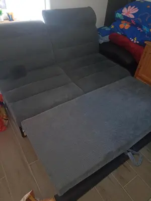 a gray couch sitting in a living room at best price apparemment budget brussels in Brussels