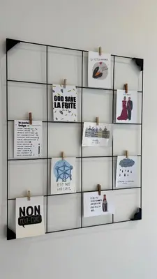 a shelf with signs and boxes on a wall at Chez Pomme in Brussels