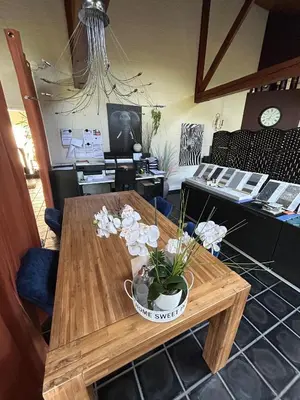 a wooden table with a potted plant on it at Steves Place Haasdonk in Beveren