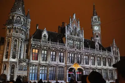 a large building with a clock tower in front of it at De Draecke Hostel in Ghent