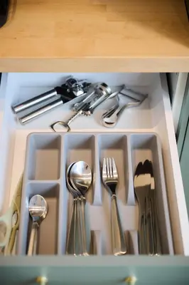 a drawer filled with utensils and silverware at Appartement Ceuppens 5 in Brussels