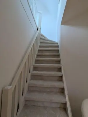 a stairway in a house with a stair case at upper st in Brussels