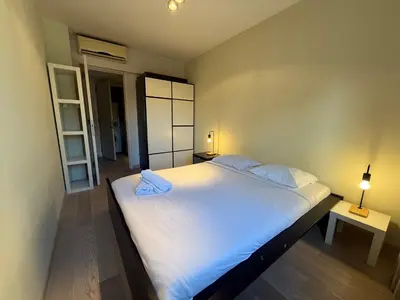a bedroom with a large white bed with two pillows at Apartment with 2 Bedrooms - Sleeps 6 in Brussels