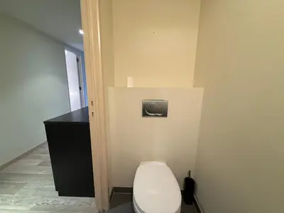 a bathroom with a toilet and a black counter at Apartment with 2 Bedrooms - Sleeps 6 in Brussels