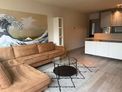 a living room with a couch and a table at Apartment with 2 Bedrooms - Sleeps 6 in Brussels