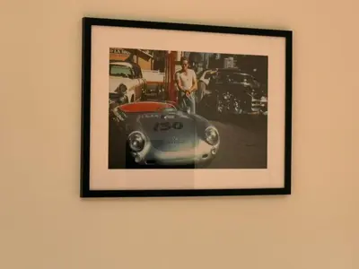 a framed picture of a car on a wall at L'Excelsior Suites in Brasschaat