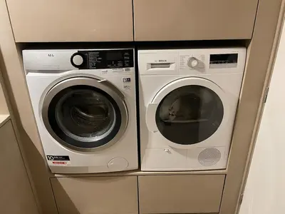 two washing machines sitting next to each other at Luxury apartment with a view of the MAS in Antwerp
