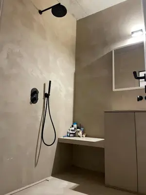 a bathroom with a shower and a sink at Luxury apartment with a view of the MAS in Antwerp