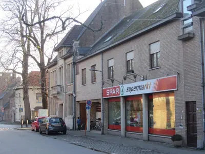 a store on the side of a building on a street at Klik Klak Studio in Bornem