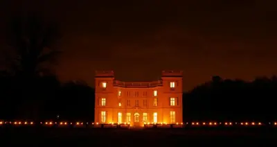 a large building with lights on it at night at Klik Klak Studio in Bornem