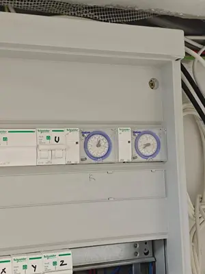 a machine with three clocks on a shelf at Tomorrowland 350 m Close Quiet Stay in Boom