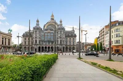 a large building in the middle of a city at Apartment in the center of Antwerp in Antwerp