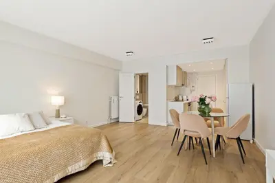 a bedroom with a bed and a table and chairs at Apartment in the center of Antwerp in Antwerp