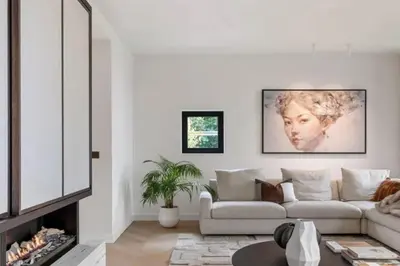 a living room with a couch and a fireplace at Superb Apartment Pierson in Brussels
