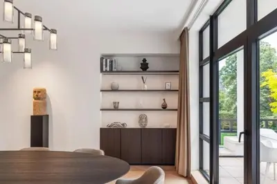 a dining room with a table and a large window at Superb Apartment Pierson in Brussels