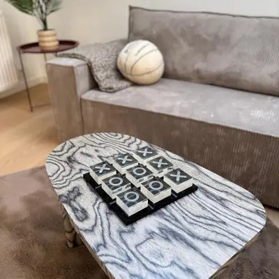 a living room with a couch and a coffee table at Le Cozy Bijou in Antwerp