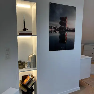 a hallway with a wall with a picture of a building at Le Cozy Bijou in Antwerp