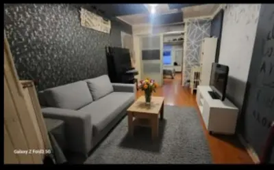 a living room with a couch and a coffee table at appartement Laken Belgique in Brussels