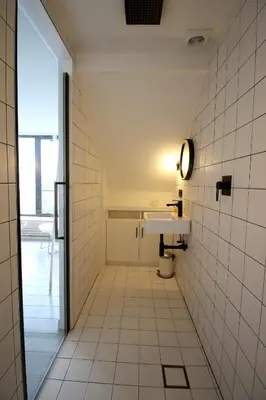 a bathroom with a sink and a mirror at Canopée guesthouse in Brussels