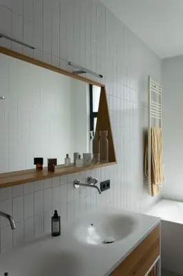 a bathroom with a sink and a mirror at Canopée guesthouse in Brussels