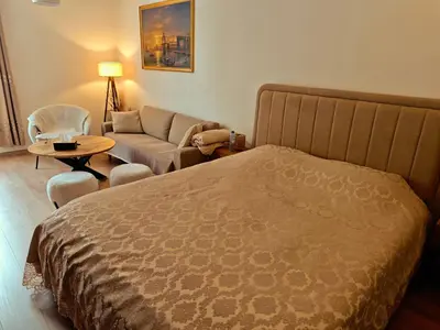 a hotel room with a bed and a couch at Brussels Cozy Studio in Brussels
