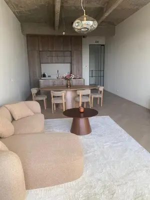 a living room with a couch and a table at Verliefd in Antwerpen in Antwerp