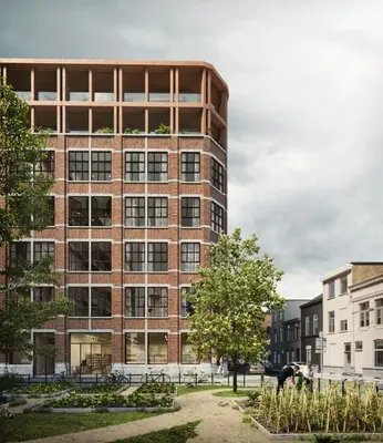 a large brick building in front of some buildings at Verliefd in Antwerpen in Antwerp
