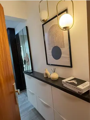 a room with a shelf with a picture on the wall at Charming apartment in Bruxelles in Brussels