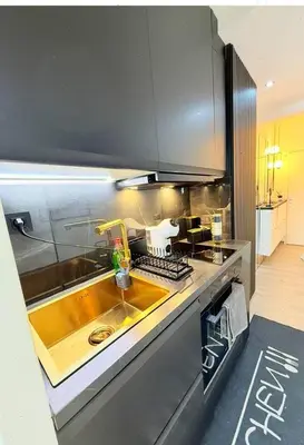 a kitchen with a sink and a counter top at Charming apartment in Bruxelles in Brussels