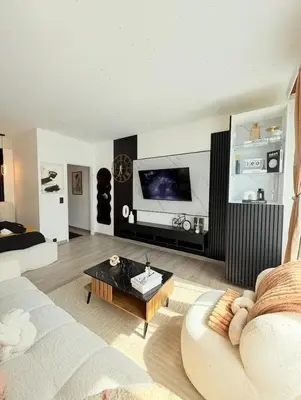a living room with a couch and a coffee table at Charming apartment in Bruxelles in Brussels