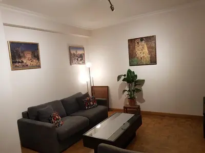 a living room with a couch and a coffee table at Central cosy apartment in Brussels
