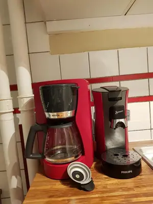 a red blender sitting on top of a counter at Central cosy apartment in Brussels