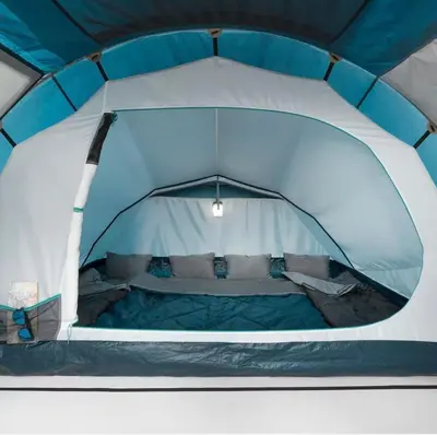 a blue and white tent with a bed in it at Maison Tomorrowland in Aartselaar