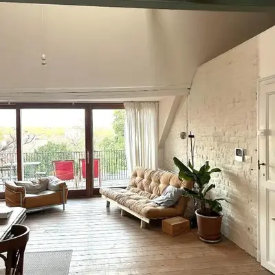 Penthouse studio in a family house