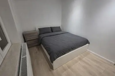 a small bedroom with a bed in a room at Nice apartment close to Zaventem airport in Kampenhout