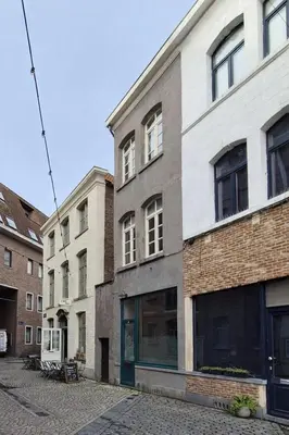 a building on the side of a street at Alcazar in Mechelen