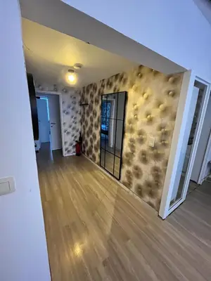 an empty living room with a wall covered in cottages at Vilvoorde city center in Vilvoorde