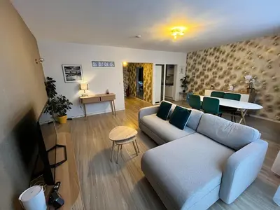 a living room with a couch and a table at Vilvoorde city center in Vilvoorde