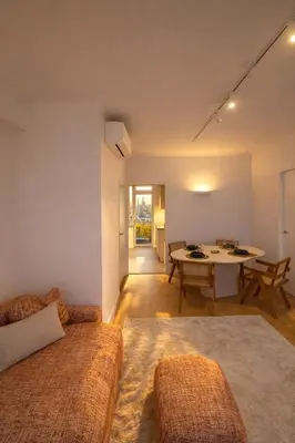 a living room with a couch and a table at Luxury penthouse in Antwerp in Antwerp
