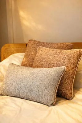a pile of pillows sitting on top of a bed at Luxury penthouse in Antwerp in Antwerp