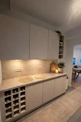 a kitchen with a counter top with wine bottles at Luxury penthouse in Antwerp in Antwerp