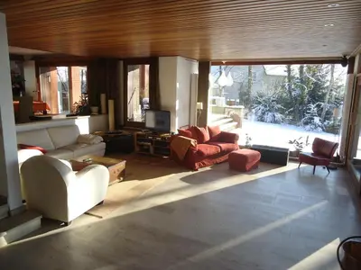 a living room with two couches and a television at Green Hill Guest Room Overijse in Overijse