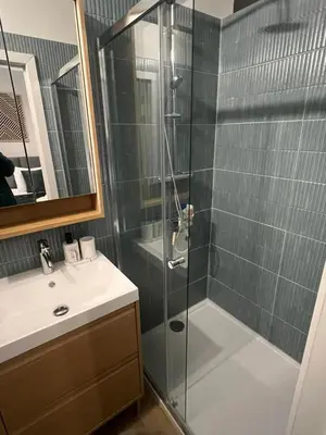 a bathroom with a shower and a sink at Secret Garden 2