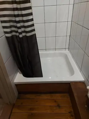 a bathroom with a bath tub with a shower curtain at Deurne in Antwerp