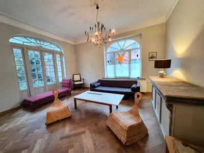 a living room with a couch and a table at Furnished house BXL- for team of workers in Beersel